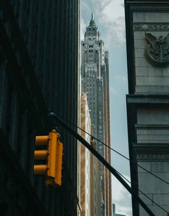 a city street sign sitting below skyscrs