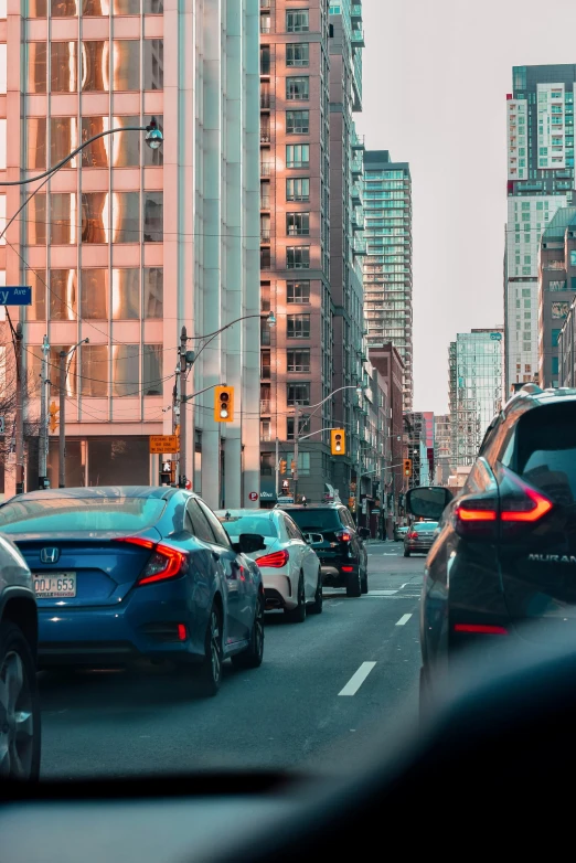 a busy city street with many vehicles and buildings