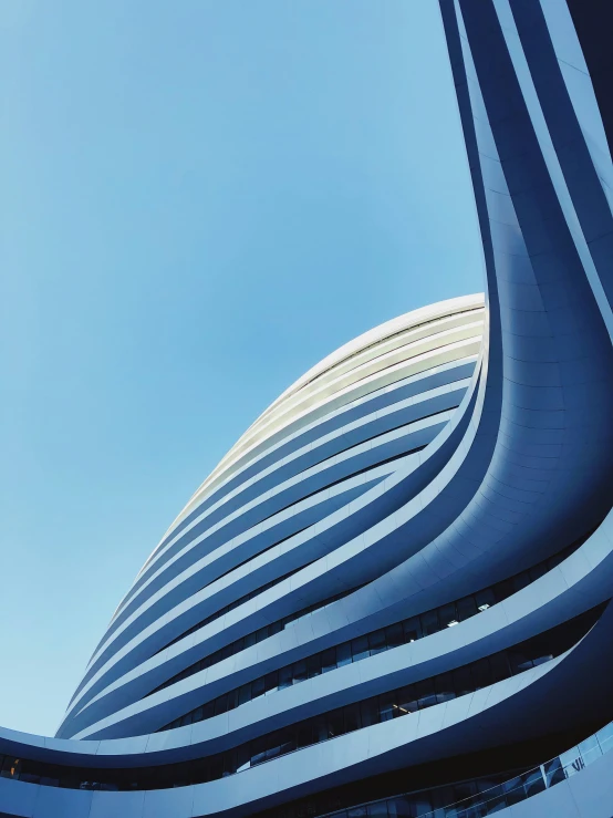 the building's curve shaped exterior has been designed to mimic the surrounding of the blue sky