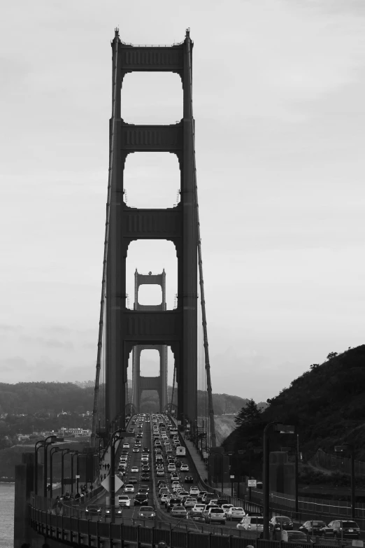 traffic backed up on a busy bridge by water