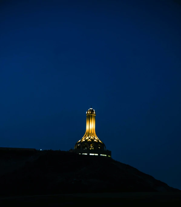 a clock at the top of a tall building