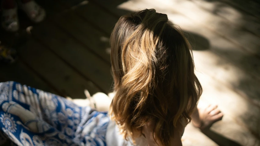 a woman with long hair wearing a dress