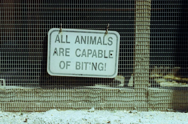 a sign in the front yard of a zoo