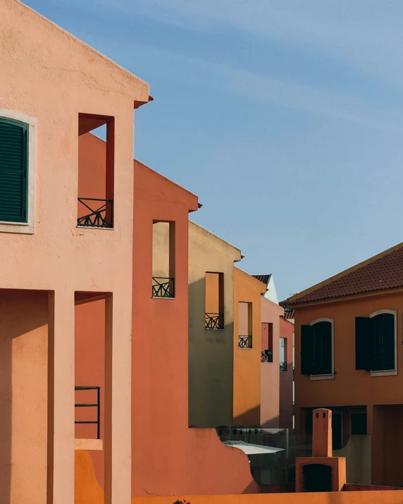 a row of houses next to each other on a city street