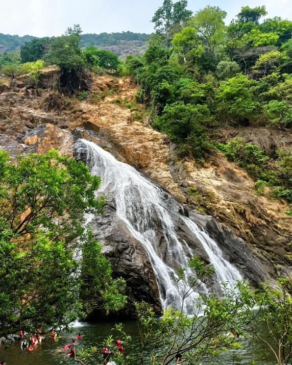 a waterfall is being opened with people in it