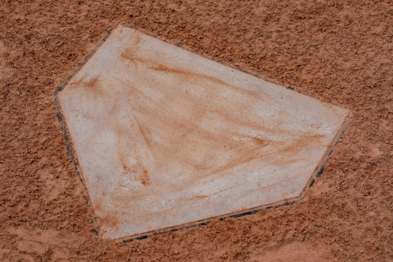 a close up of a baseball field with dirt