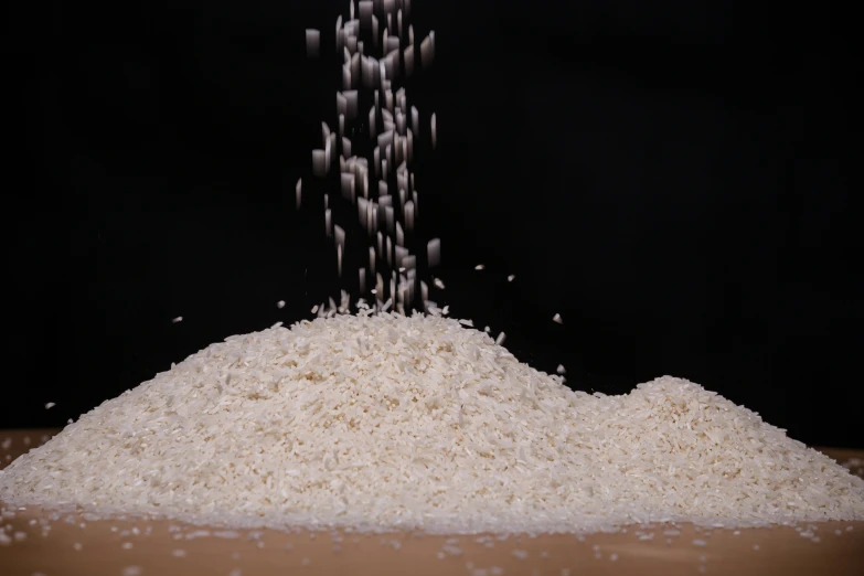 a pile of rice that has been sprinkled with salt