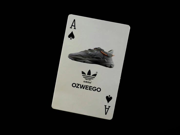 a tennis card with a picture of an adidas shoe on it