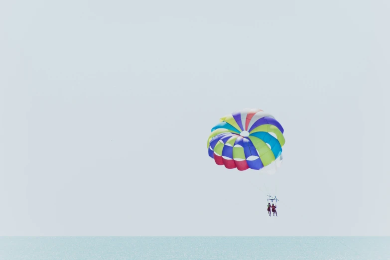 a person parasailing in the ocean on a sunny day