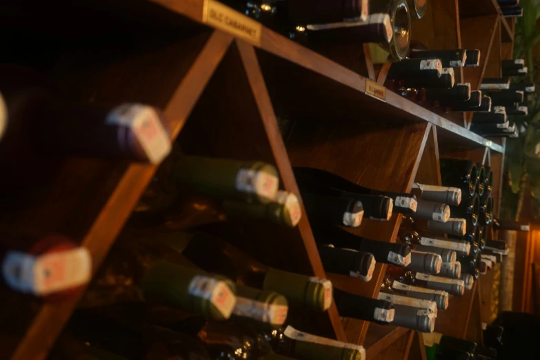 a wall filled with bottles and wine bottles