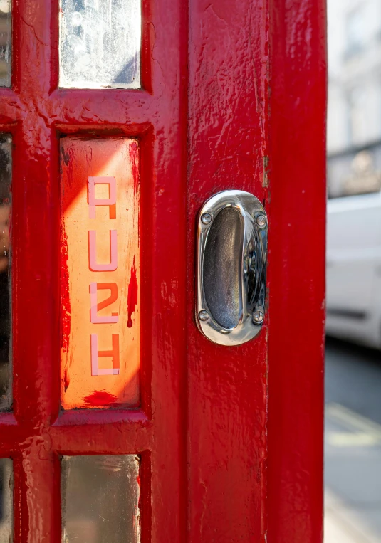 a close up of a red door with the word decal on it