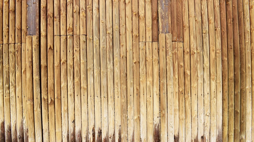 an old bamboo fence with wooden strips