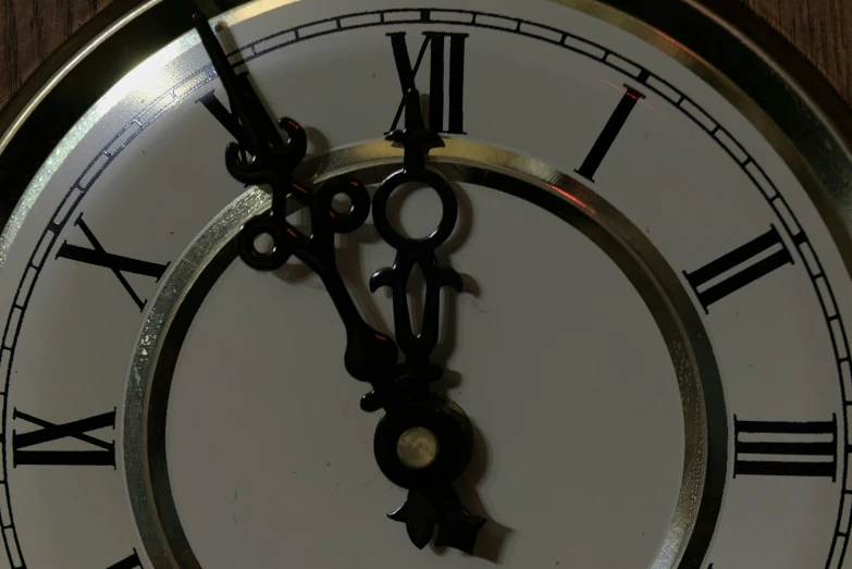 a clock with black and white numbers and hands