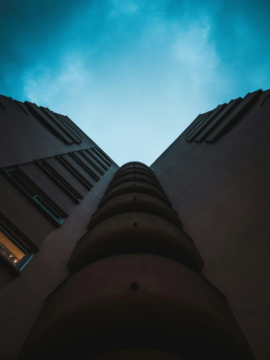 the sky and some buildings with a sky background