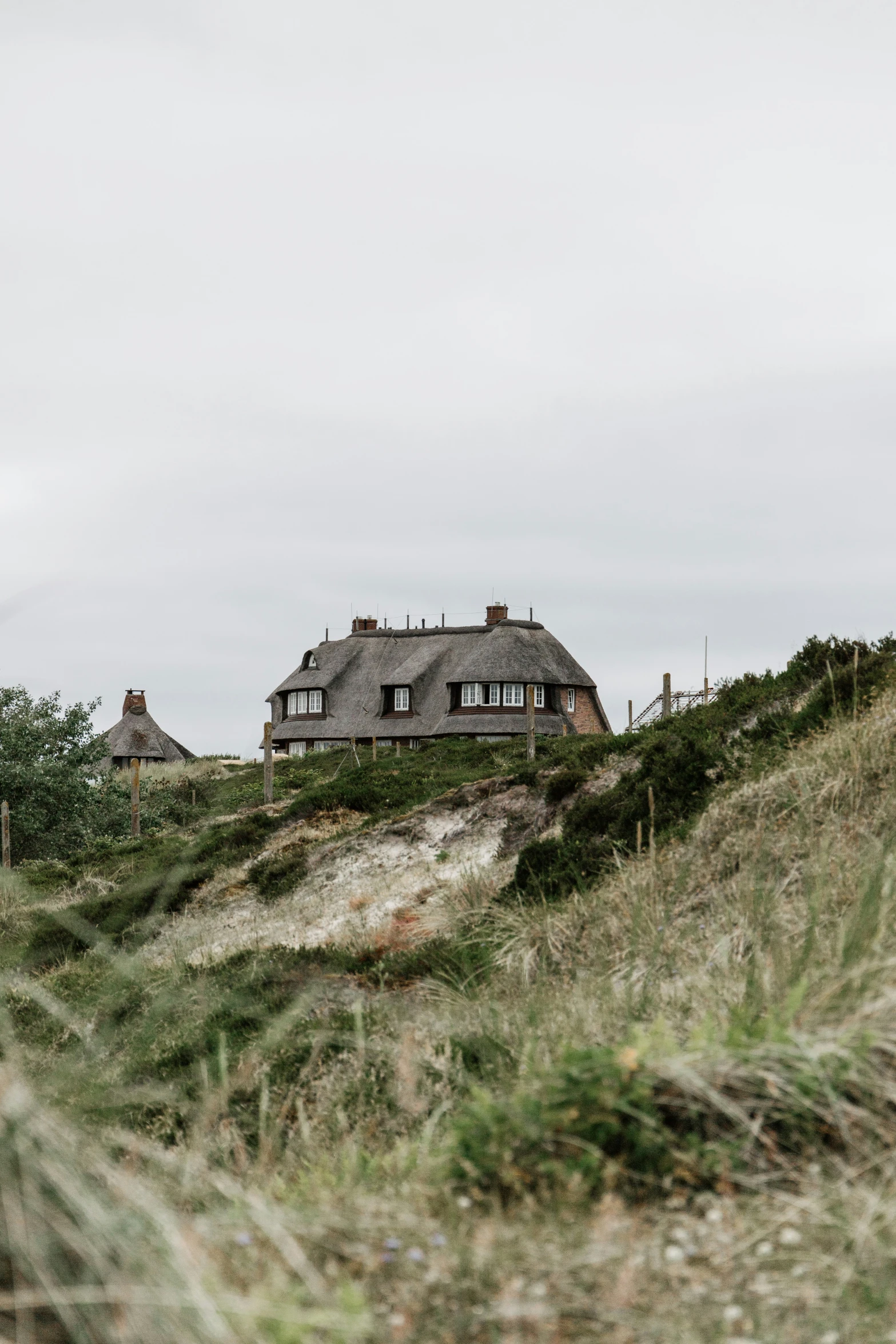 an image of a house that is on top of a hill