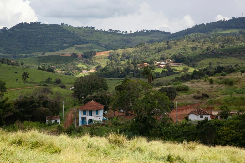 an old house and thatched roof in a beautiful rural setting