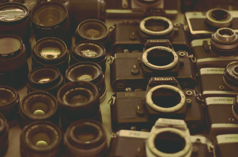 many different types of cameras all lined up together