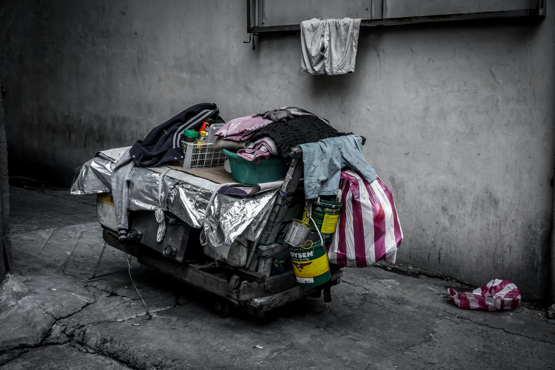 clothes on a cart outside a building