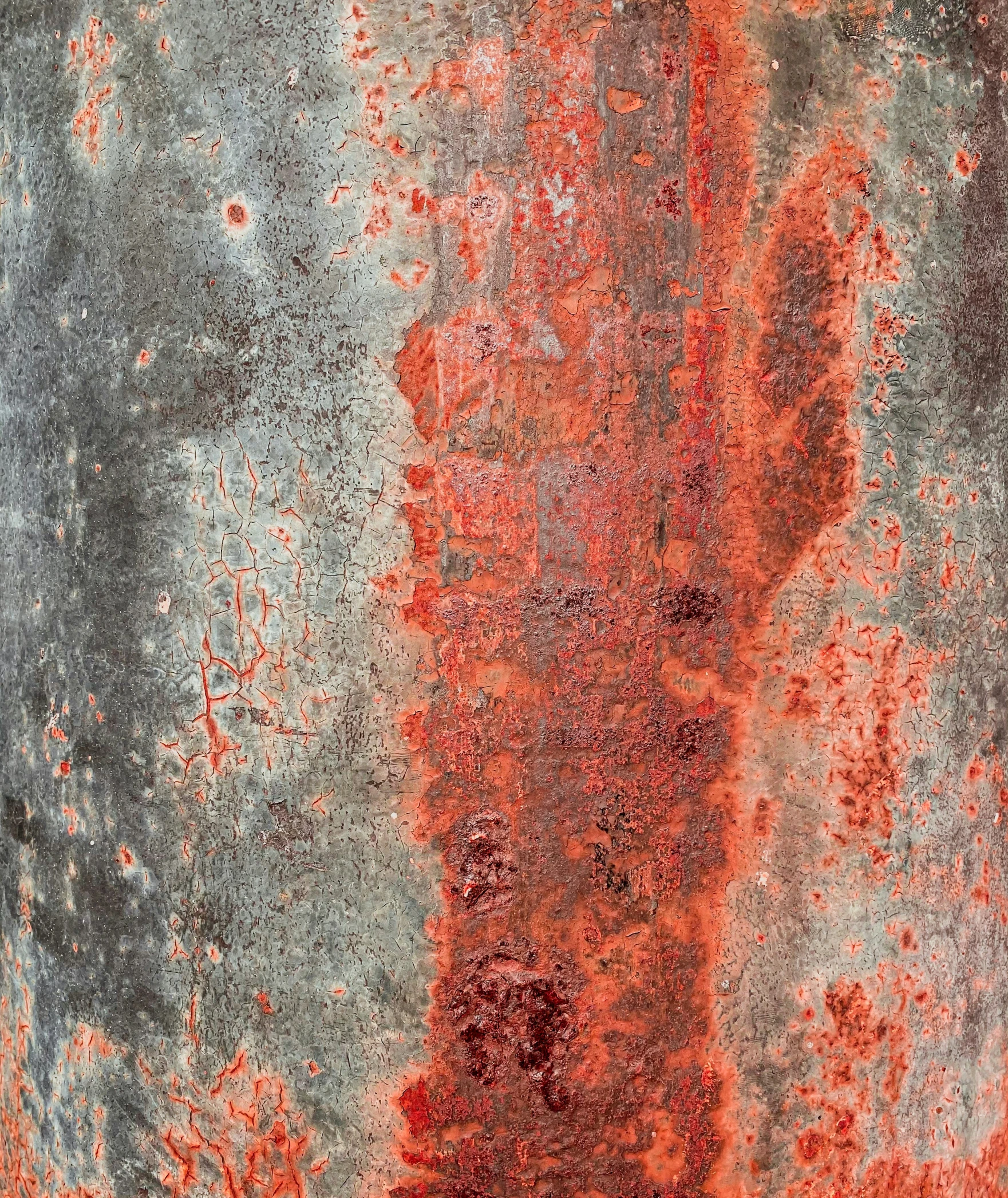 a rusted metal surface with various colors and patterns