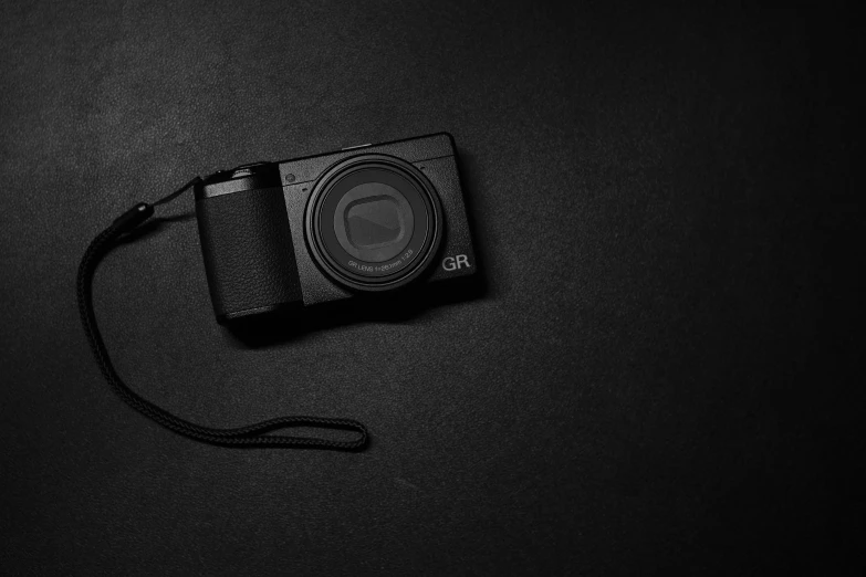 a camera on a black background is pictured