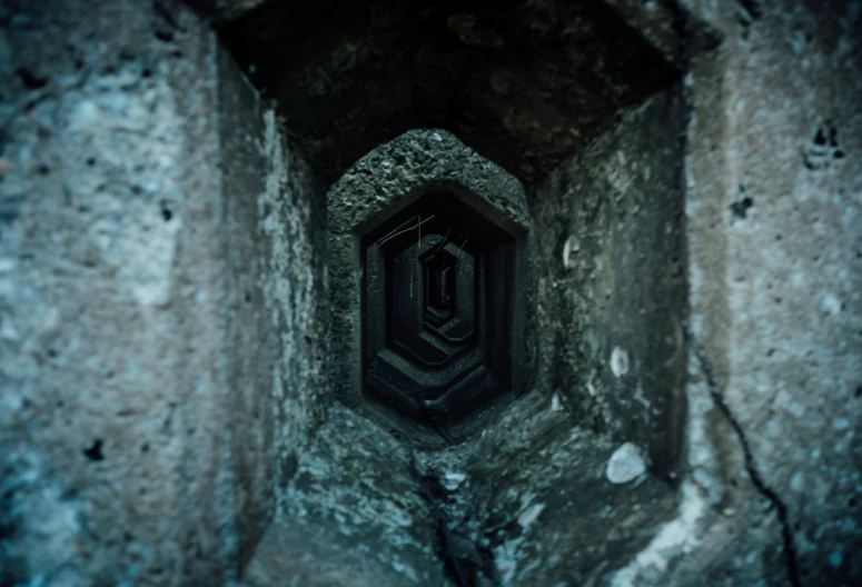 some kind of tunnel with a very dark door