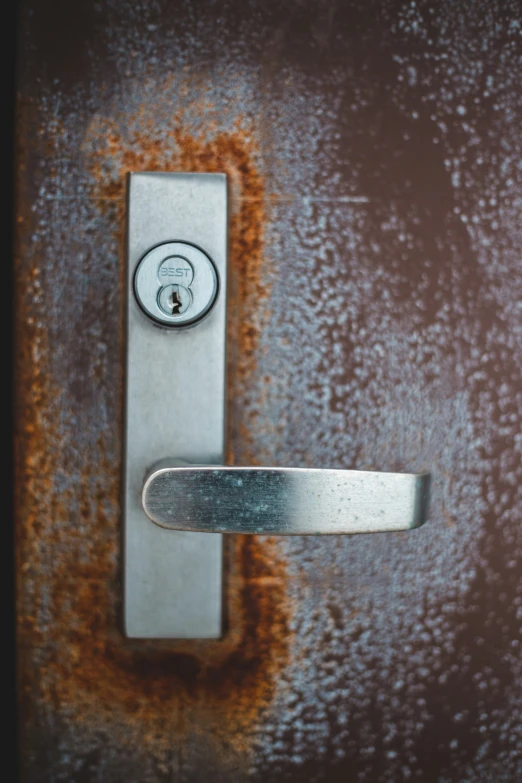 the door handle is shown with rust on it