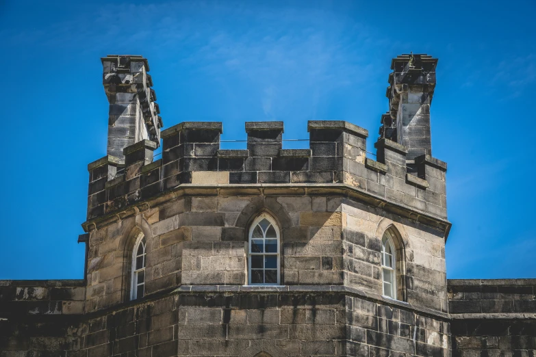 a tower with several windows and some turrets