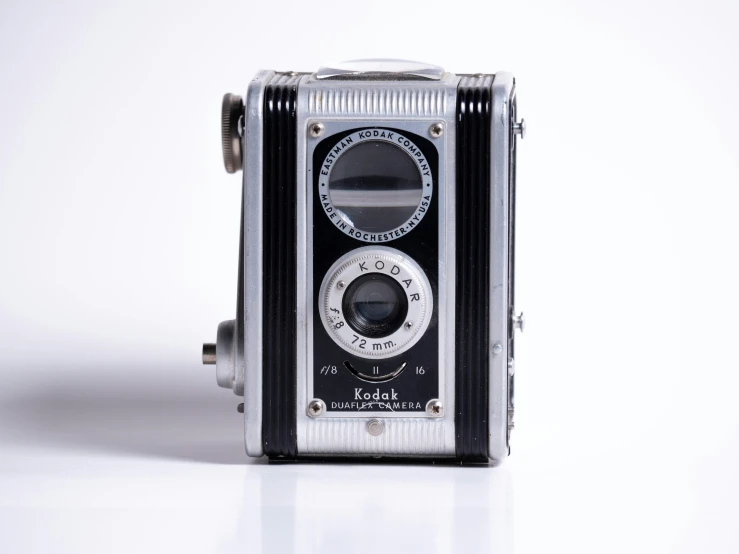 an old looking camera in a white back ground
