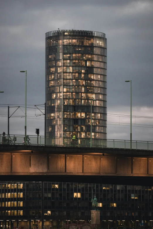 tall buildings in front of the train tracks near a highway