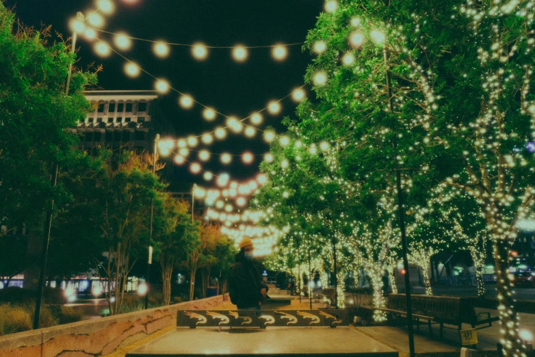 a bench and many lights on the night sky