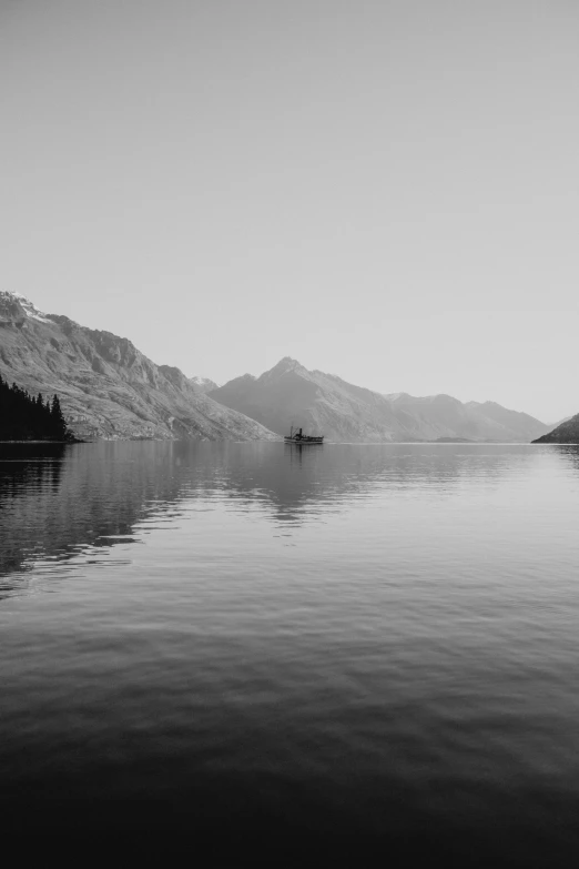 an image of a mountain lake with a boat