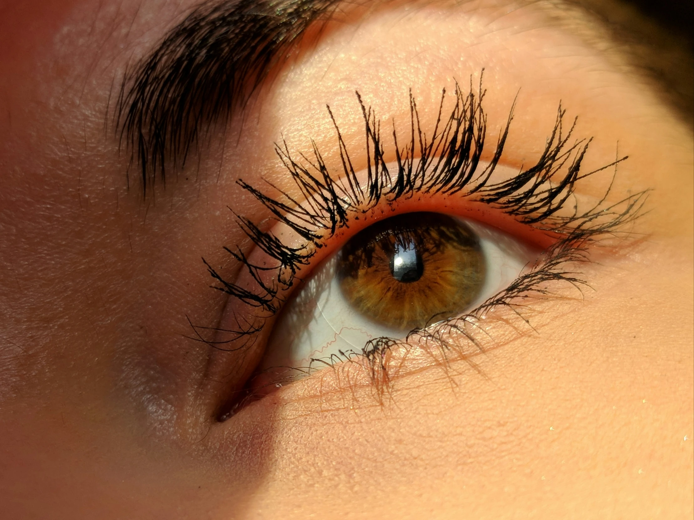 a person is staring with large long lashes
