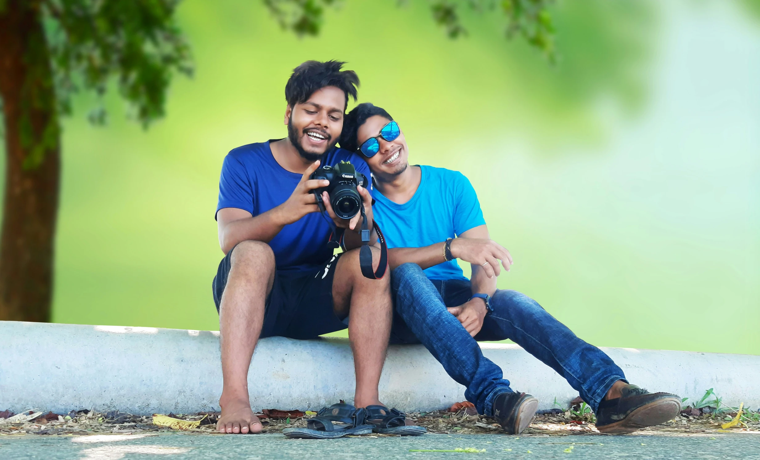 a man and woman take pictures with their digital camera