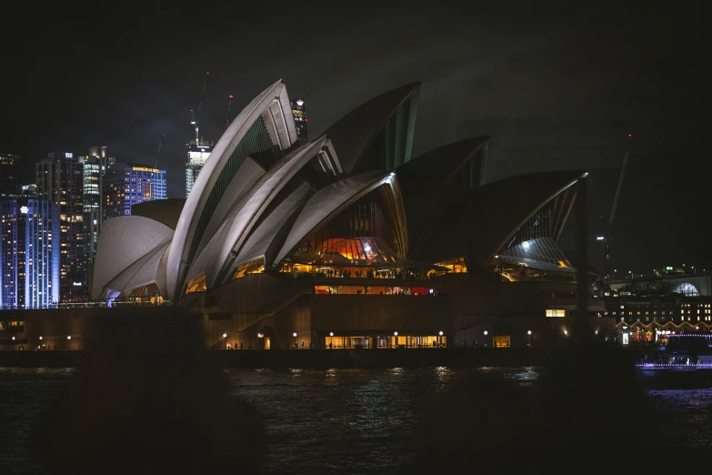 the sydney opera theatre lit up with christmas lights