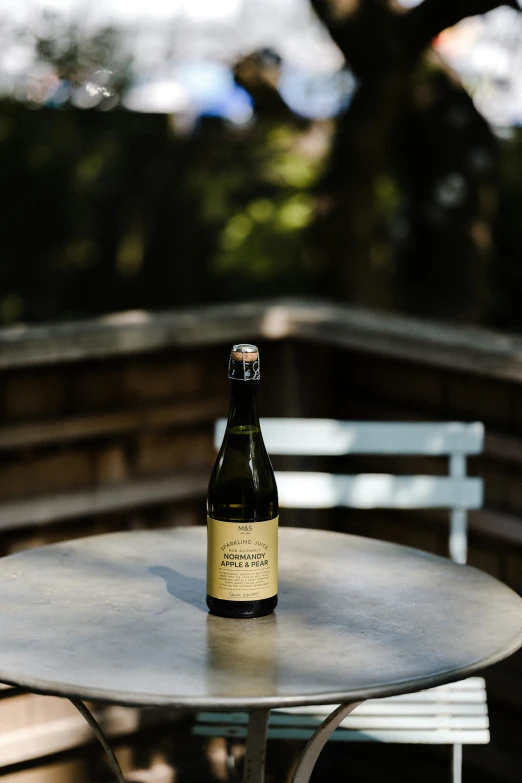 a beer bottle sitting on top of a white table