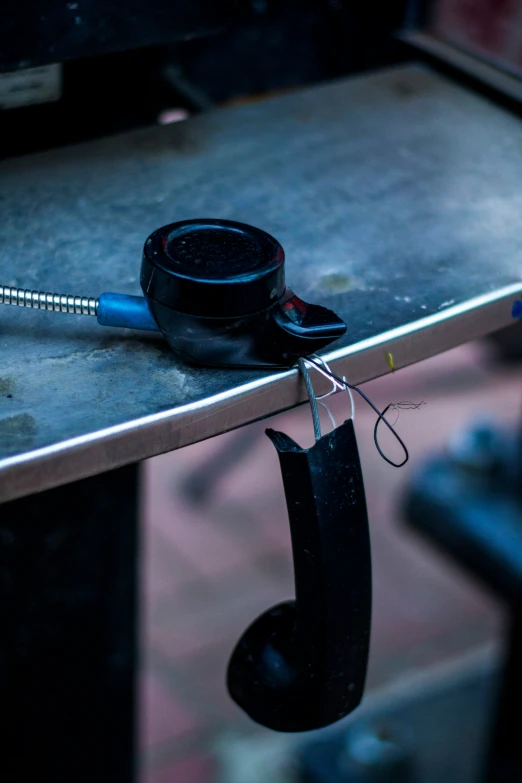 an old fashioned rotary type telephone on a table