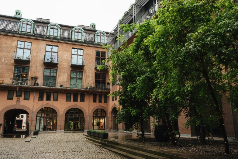 an outside view of a building with steps and trees in front