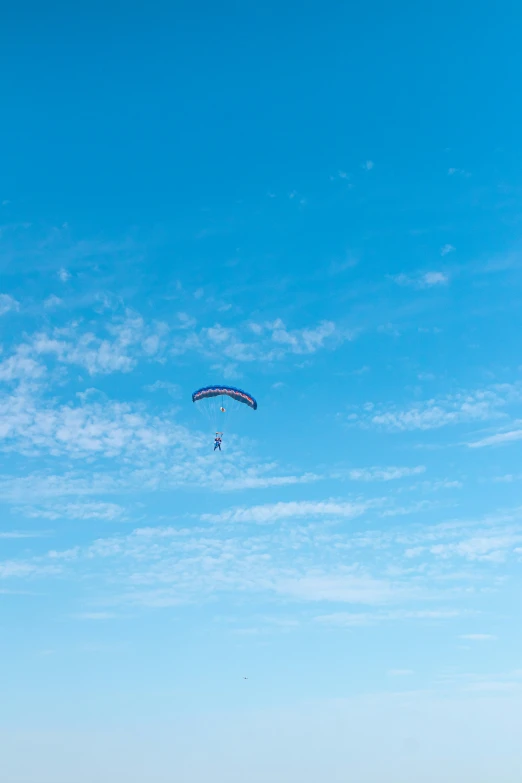 people are at the beach on the water flying kites