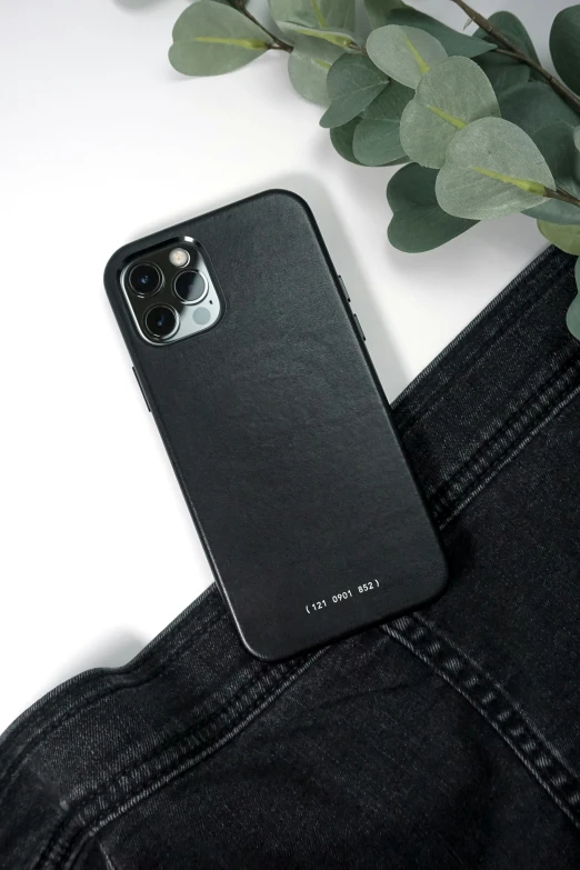 the leather case is on top of the black phone