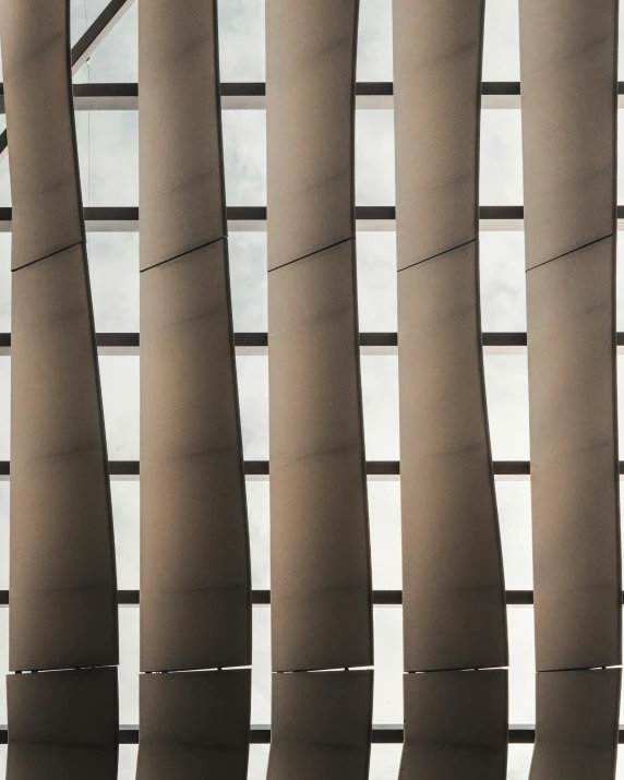 a po of the inside of an airport with vertical blinds