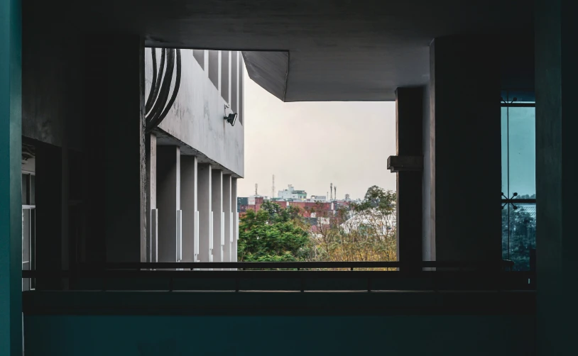 an image from inside the building looking out onto a small city