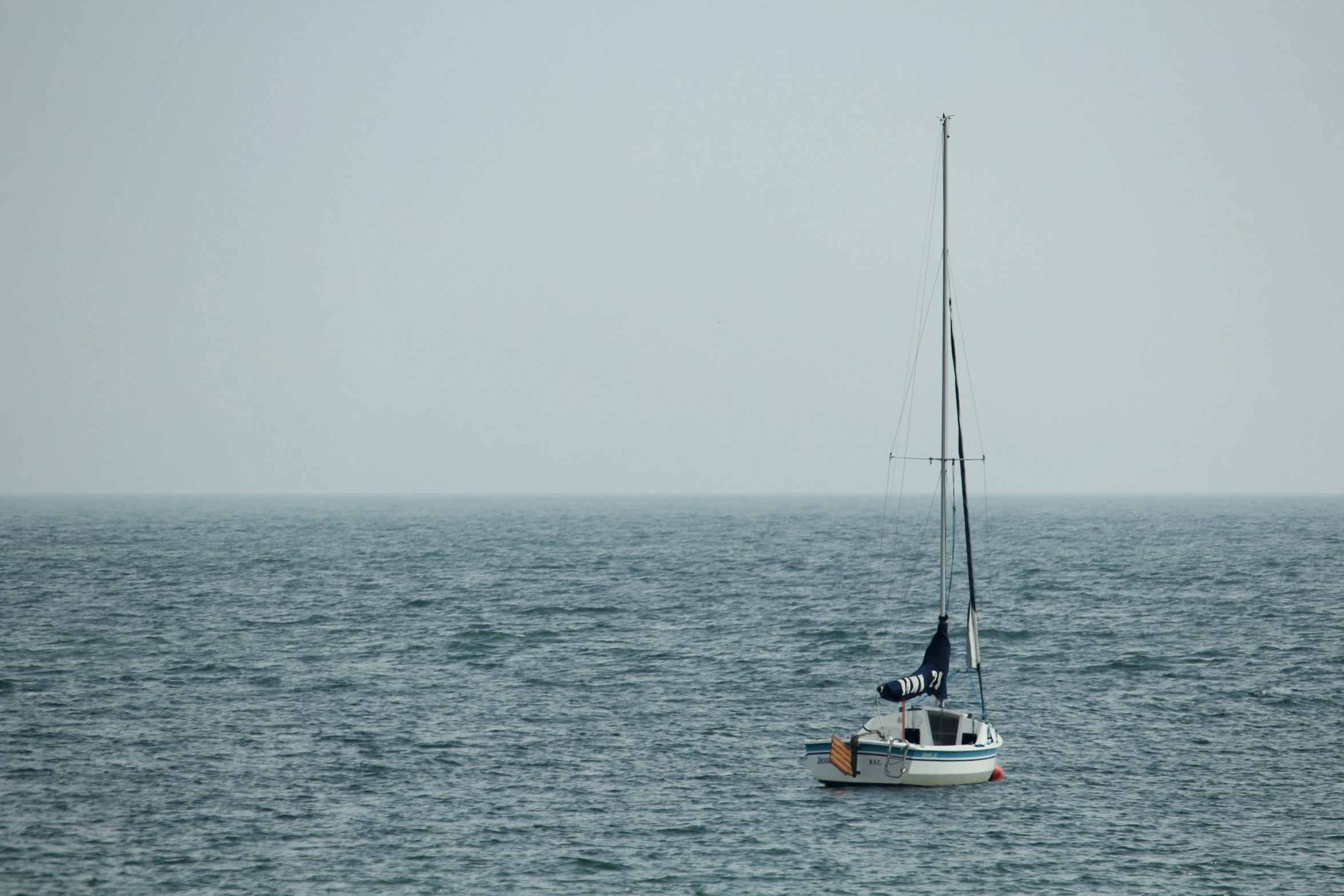 a small boat out on the open ocean