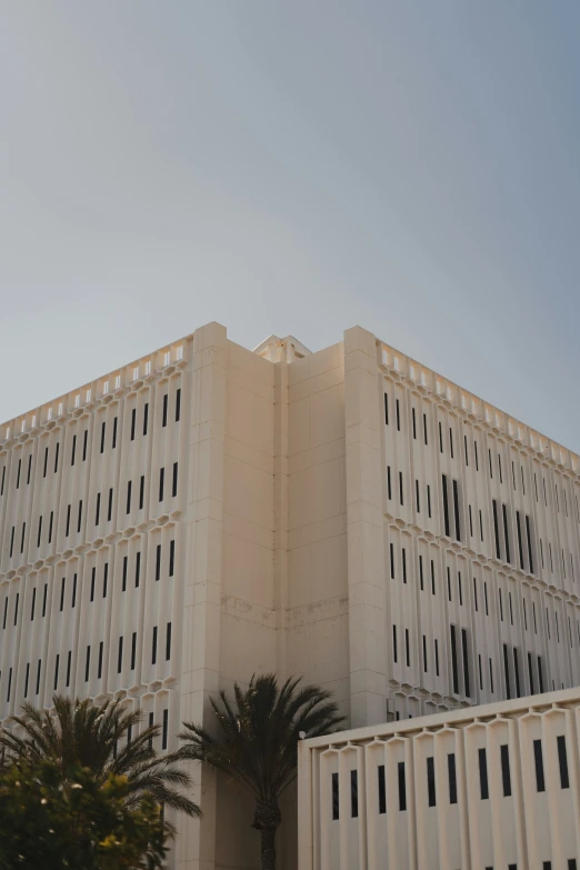 the top of a tall building is covered with black shutters