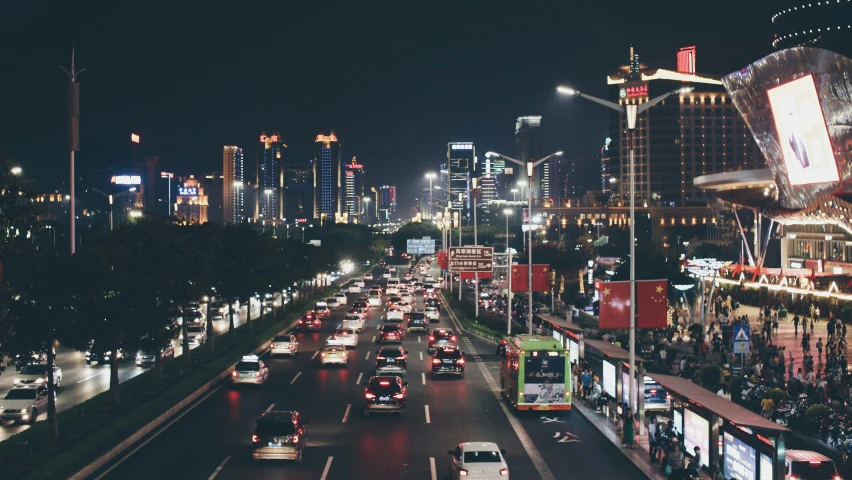 an image of night time traffic on the busy street