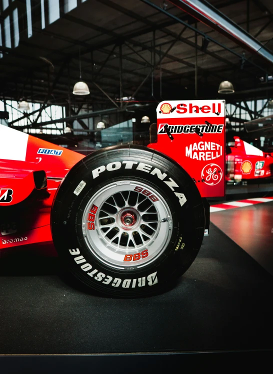 a race car sitting on top of a display case