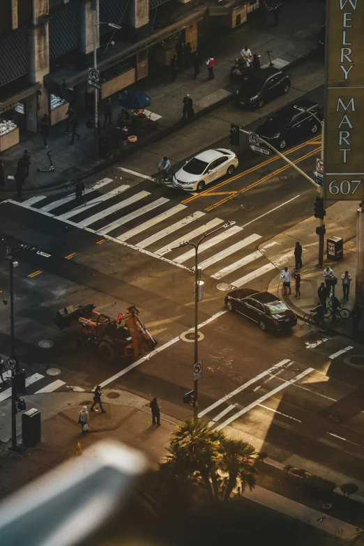 a cross walk at an intersection where vehicles are stopped