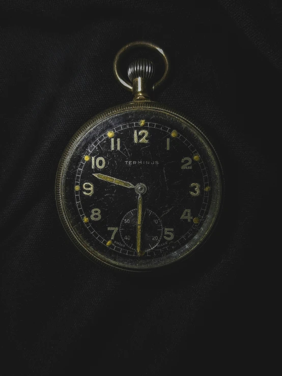 an old pocket watch with time is showing