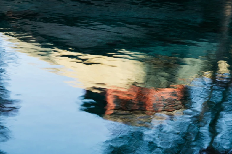 there are a lot of clouds reflecting in the water