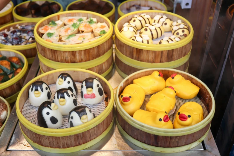 a bunch of wooden containers filled with different types of donuts