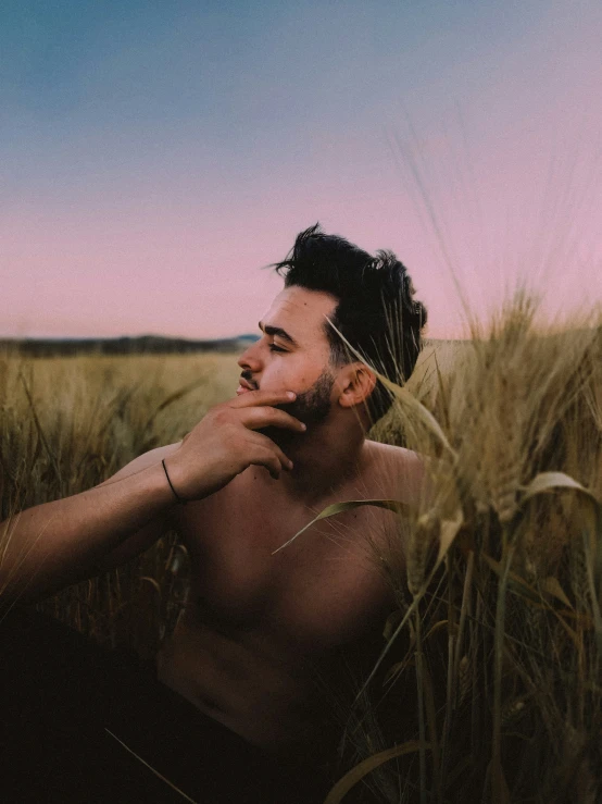 a man standing in a field of grass